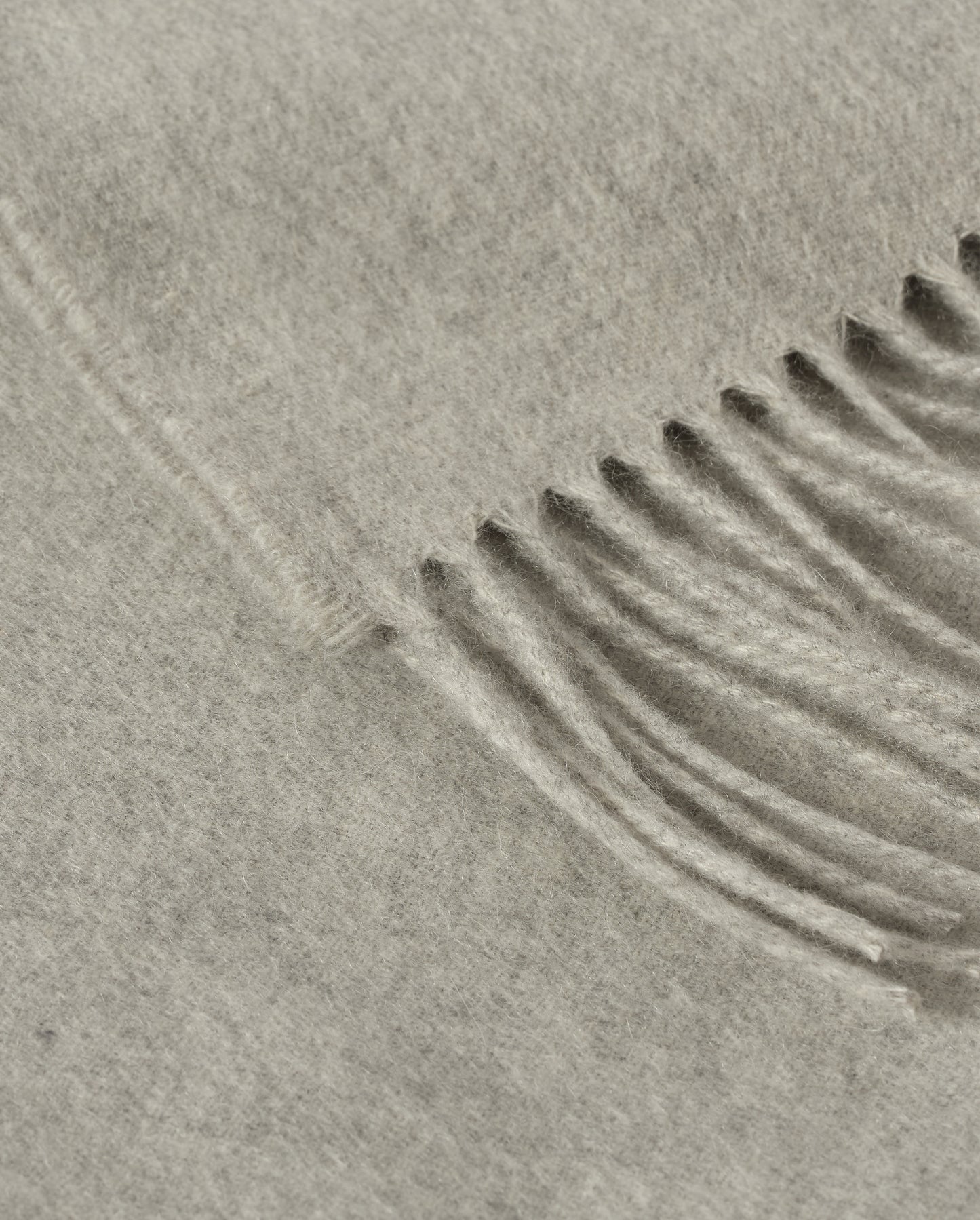 Johnstons of Elgin Interiors Collection  Silver Cashmere Throw on a wooden chair background  WA000055HA0100ONE