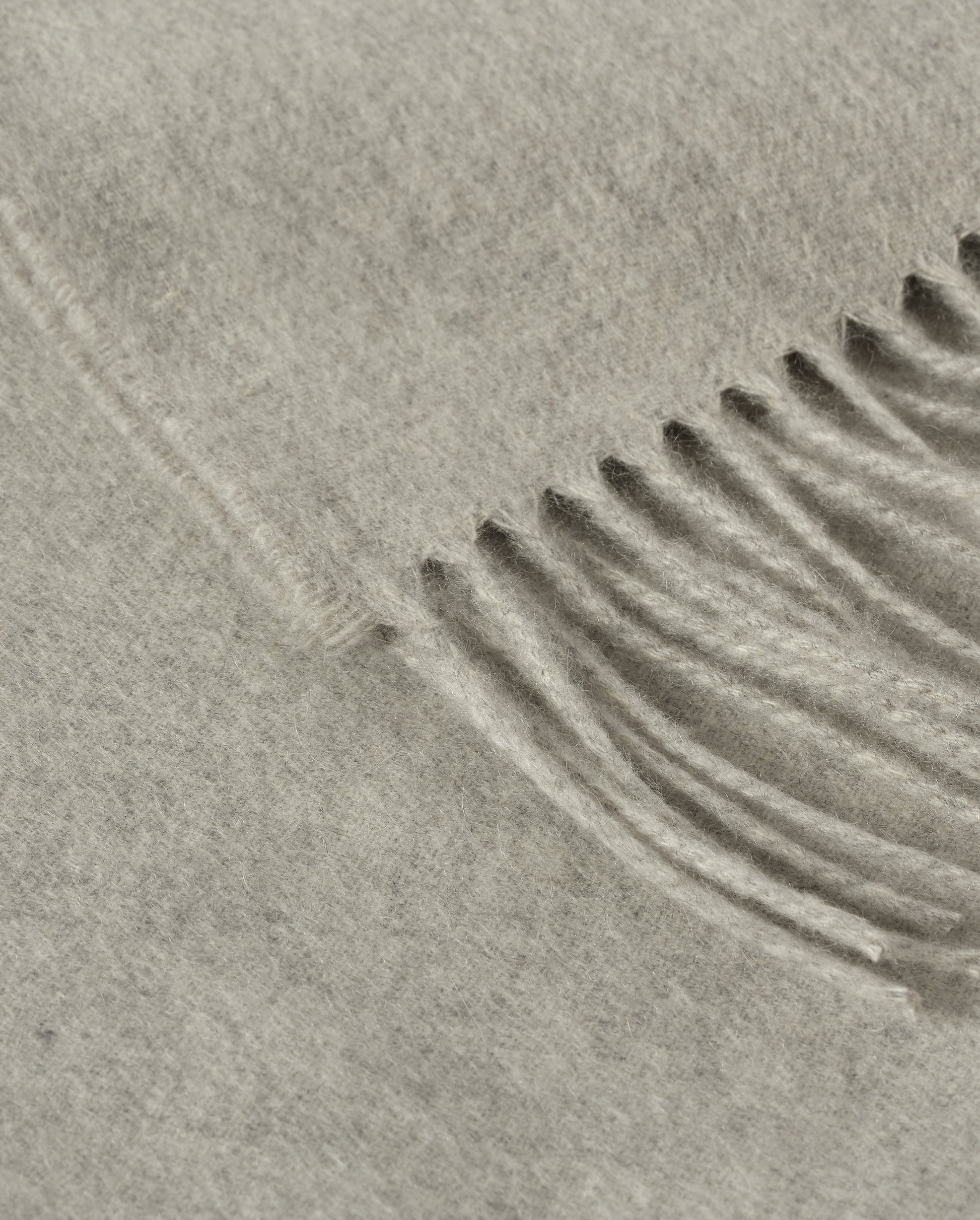 Johnstons of Elgin Interiors Collection  Silver Cashmere Throw on a wooden chair background  WA000055HA0100ONE