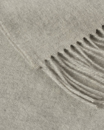 Johnstons of Elgin Interiors Collection  Silver Cashmere Throw on a wooden chair background  WA000055HA0100ONE