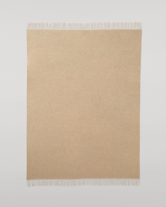 Johnstons of Elgin Interiors Collection Oatmeal Cashmere Throw on a wooden chair WA000055HB0210ONE