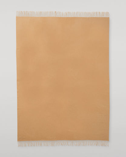 Johnstons of Elgin Interiors Collection Camel Camel Cashmere Throw on a wooden chair WA000055HB4315ONE