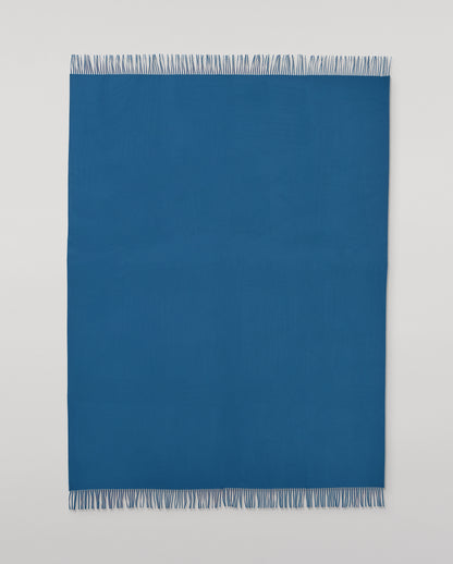 Johnstons of Elgin Plain Cashmere Throw in Petrol – luxury Scottish-woven cashmere throw in a rich petrol blue shade. WA000055SD5123ONE