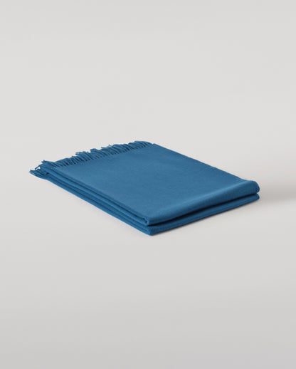 Johnstons of Elgin Plain Cashmere Throw in Petrol – luxury Scottish-woven cashmere throw in a rich petrol blue shade. WA000055SD5123ONE