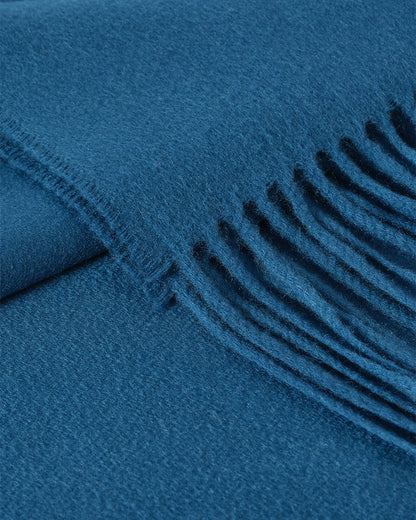 Johnstons of Elgin Plain Cashmere Throw in Petrol – luxury Scottish-woven cashmere throw in a rich petrol blue shade. WA000055SD5123ONE