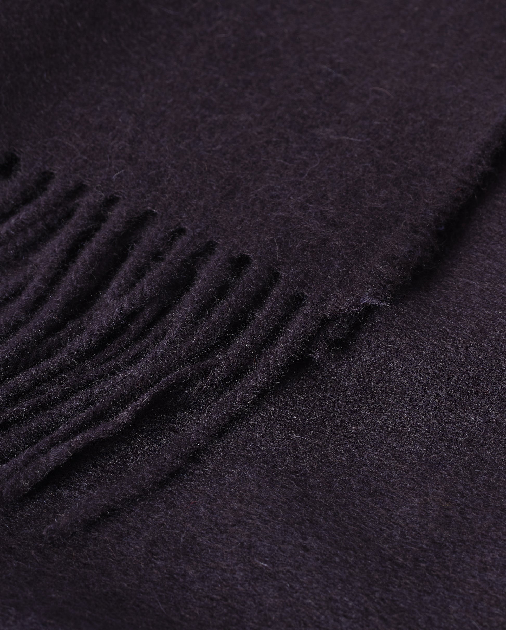 Johnstons of Elgin Interiors Collection  Dark Navy Cashmere Throw on a wooden chair   WA000055SD7330ONE