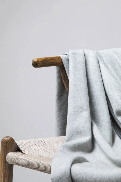 2025 Johnstons of Elgin Interiors Collection  Silver Cashmere Throw on a grey background  WA000055HA0100ONE