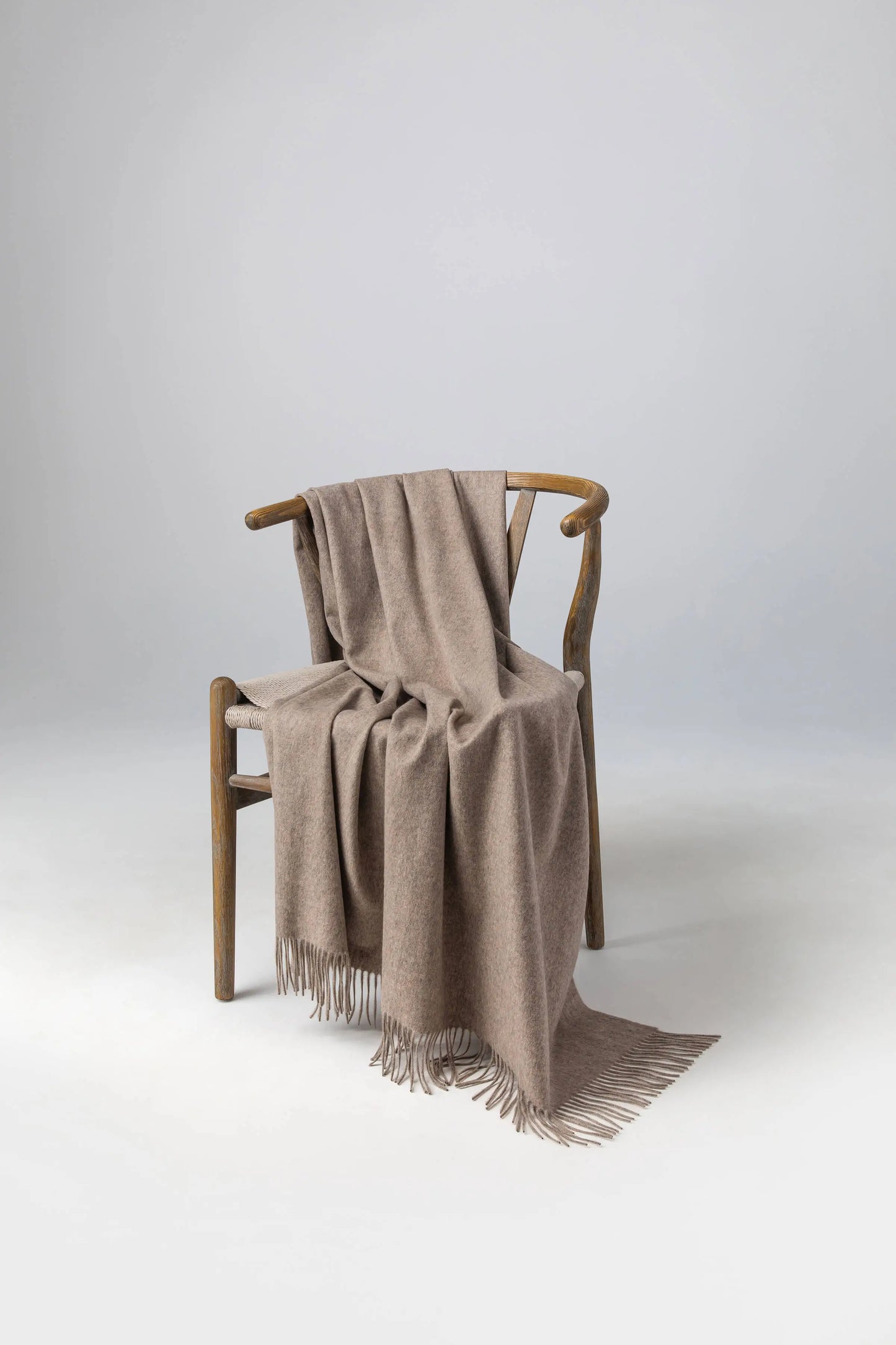 2025 Johnstons of Elgin Interiors Collection Ash Ash Cashmere Throw on a wooden chair WA000055HB4334ONE