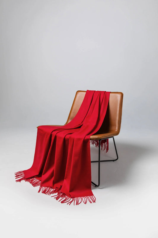 2025 Johnstons of Elgin Interiors Collection Classic Red Cashmere Throw on a brown leather chair WA000055SE0510N/A