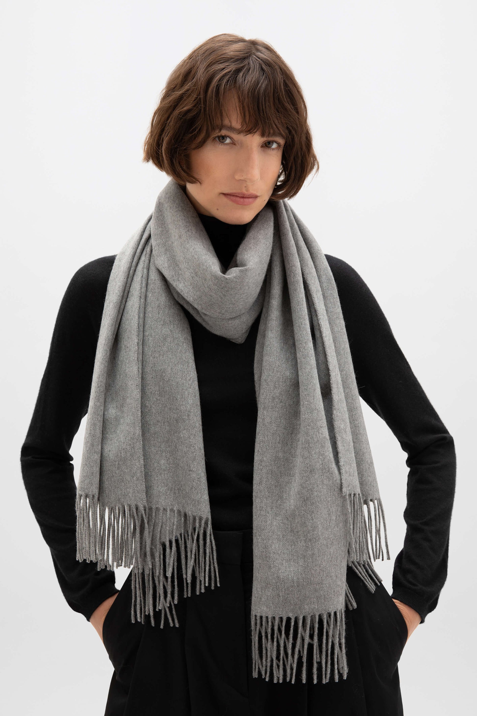 Johnstons of Elgin 100% Cashmere Stole in Mid Grey on a female model WA000056HA0501N/A