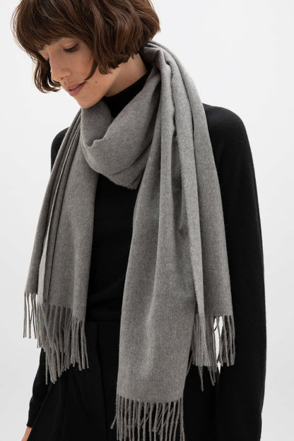 Johnstons of Elgin 100% Cashmere Stole in Mid Grey on a female model WA000056HA0501N/A