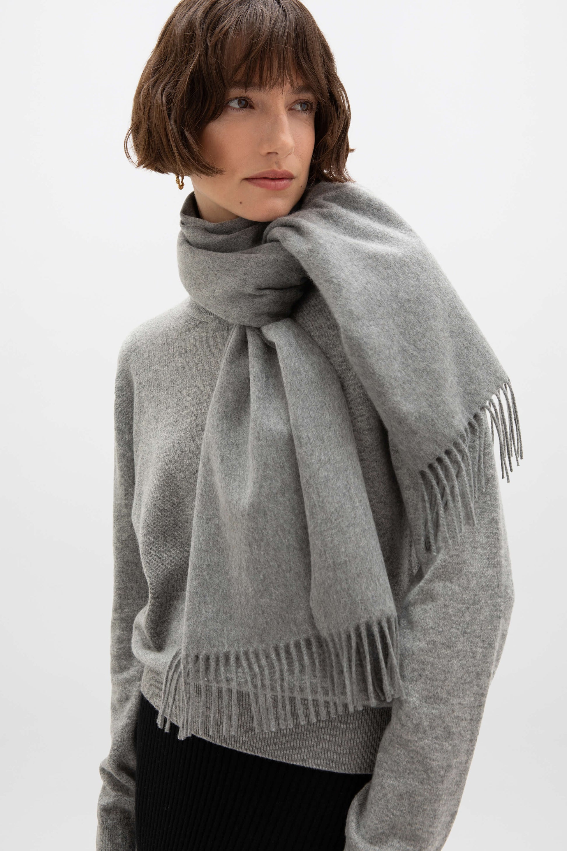 Johnstons of Elgin Oversized Cashmere Scarf in Mid Grey on a model WA000057HA0501ONE