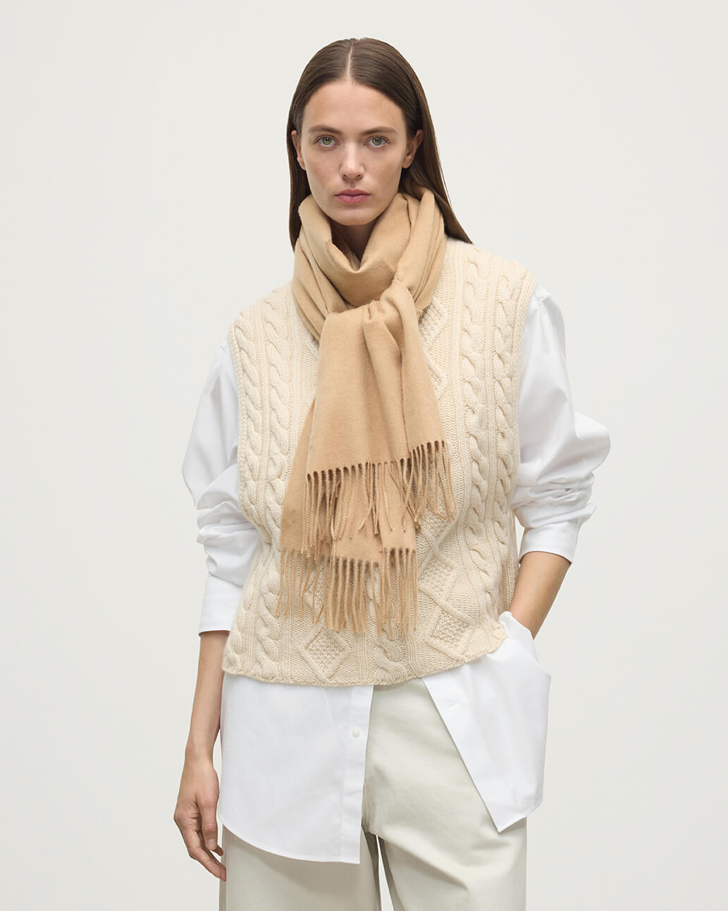 Model wearing Johnstons of Elgin AW25 Woven Accessories Camel Wide Cashmere Scarf WA000057HB4315ONE