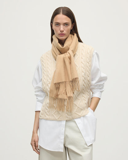 Model wearing Johnstons of Elgin AW25 Woven Accessories Camel Wide Cashmere Scarf WA000057HB4315ONE