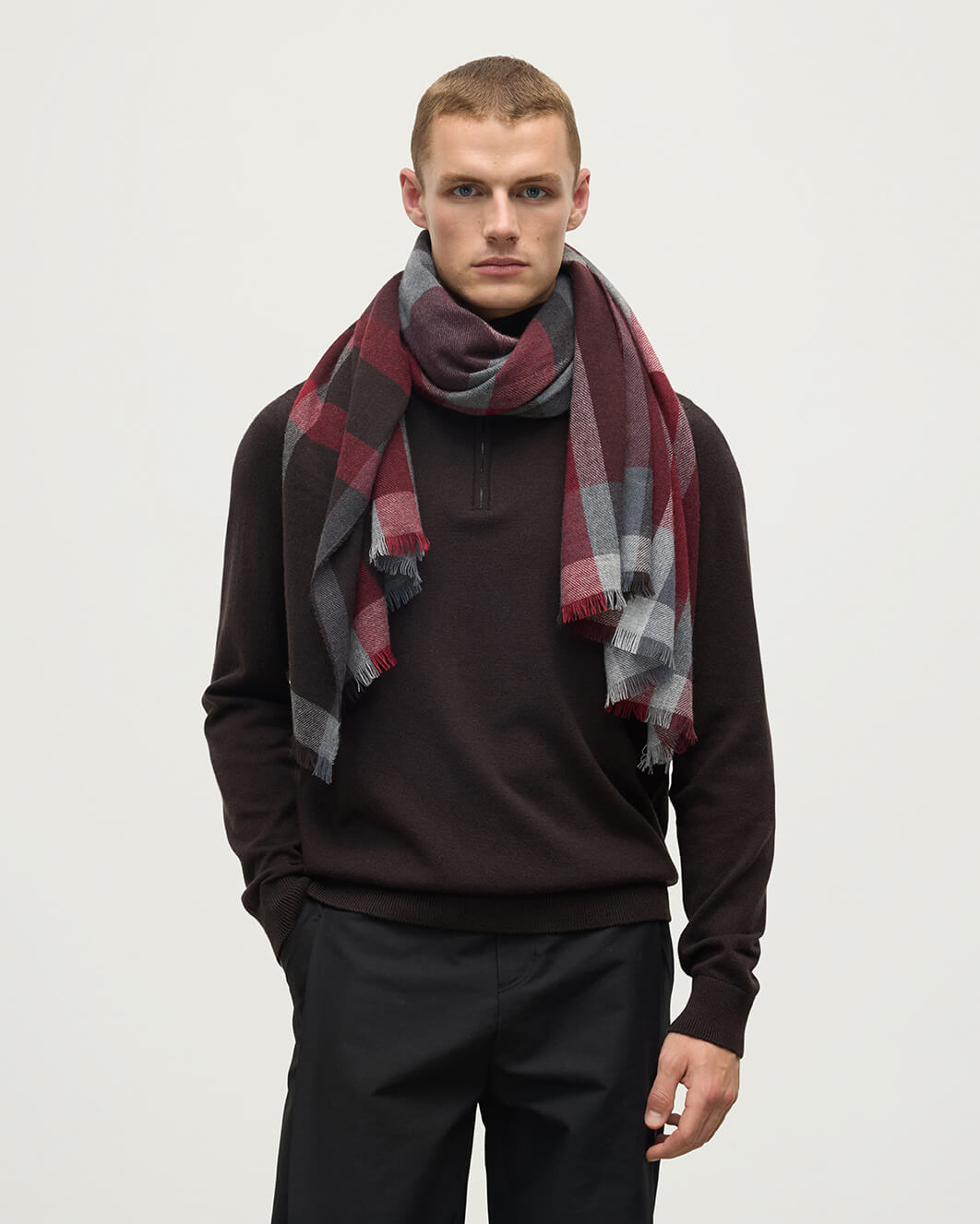 Model wears Johnstons of Elgin AW25 Woven Accessories Red Madras Check Red Cashmere Stole WA001174RU7661ONE