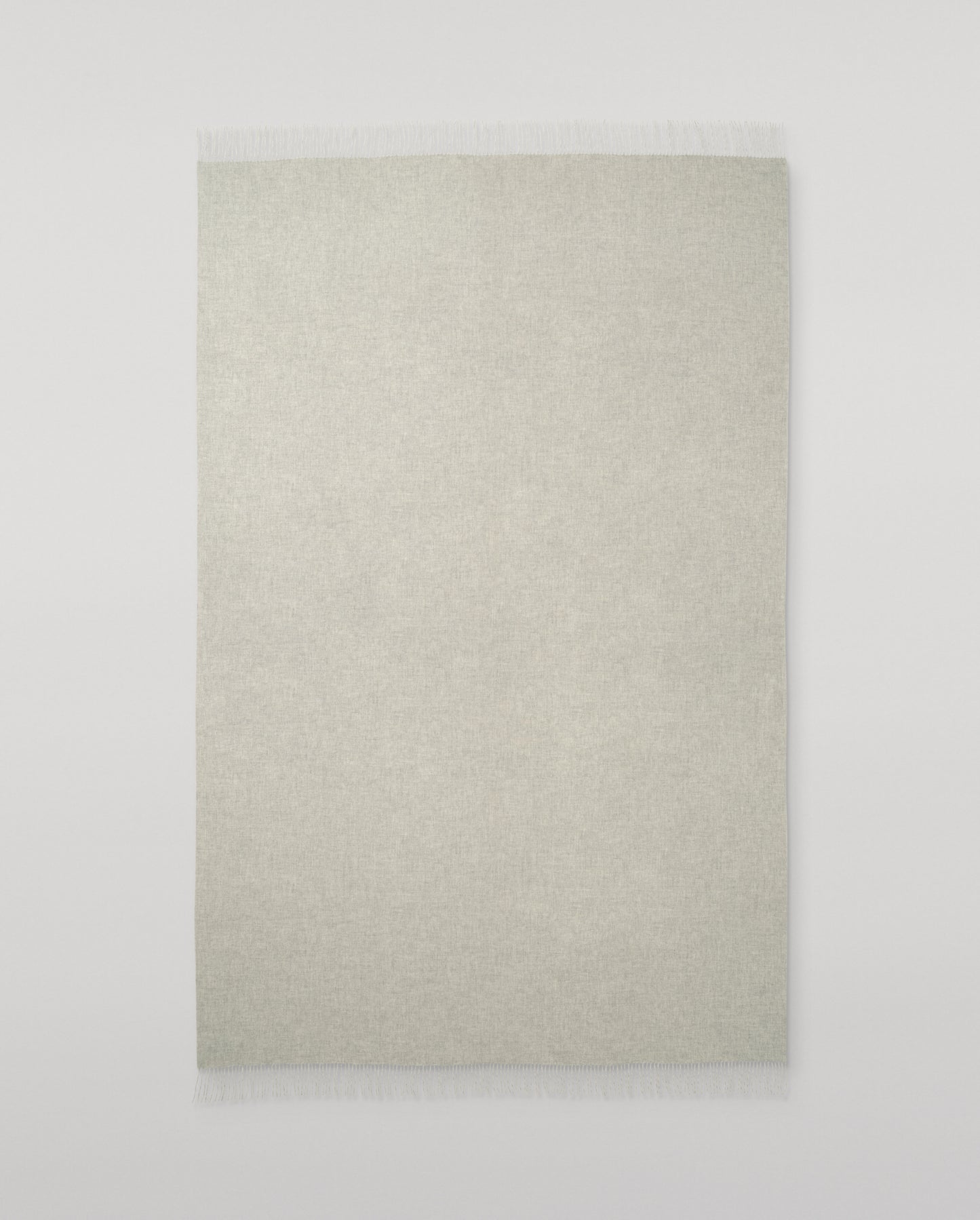 Johnstons of Elgin Interiors Collection Silver & White Reversible Cashmere Bed Throw on a white background  WA001374RU6322ONE