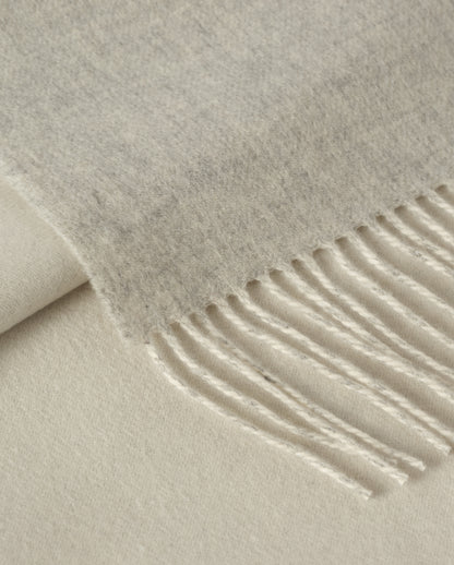 Johnstons of Elgin Interiors Collection Silver & White Reversible Cashmere Bed Throw on a white background  WA001374RU6322ONE