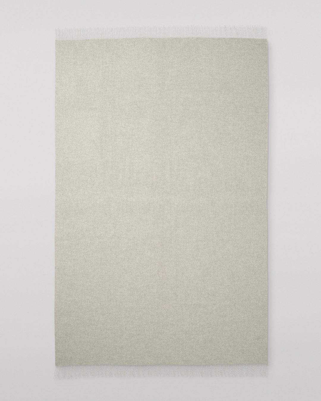 Johnstons of Elgin Interiors Collection Silver & White Reversible Cashmere Bed Throw on a white background  WA001374RU6322ONE