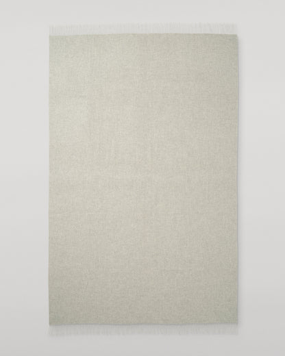 Johnstons of Elgin Interiors Collection Silver & White Reversible Cashmere Bed Throw on a white background  WA001374RU6322ONE