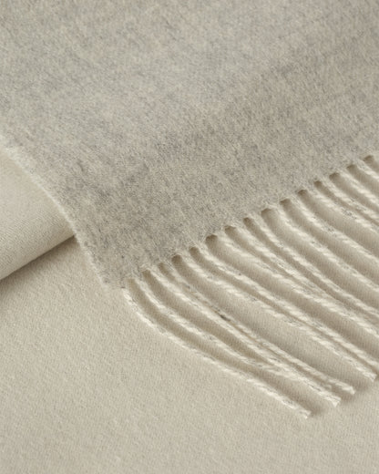 Johnstons of Elgin Interiors Collection Silver & White Reversible Cashmere Bed Throw on a white background  WA001374RU6322ONE