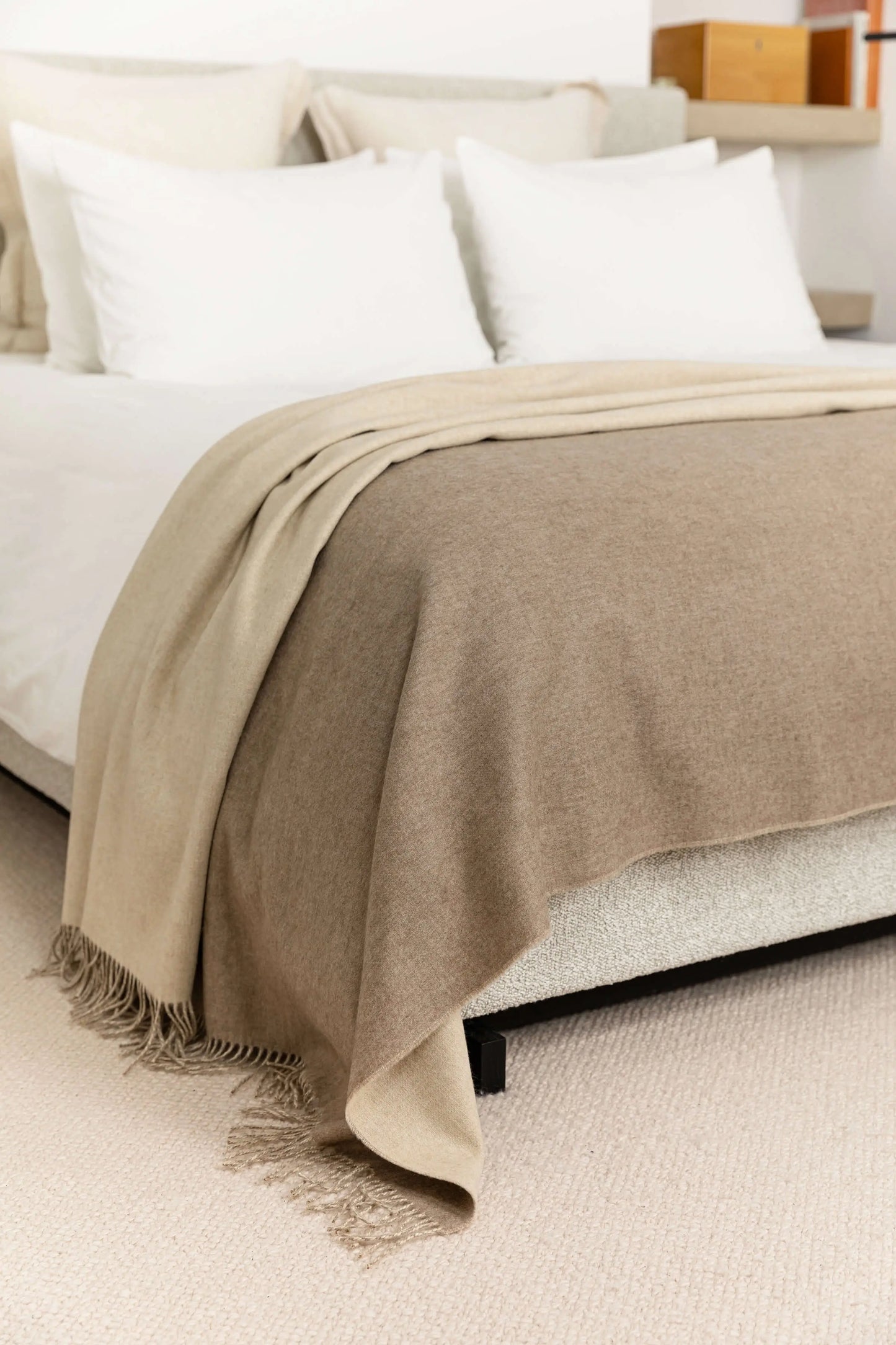 Johnstons of Elgin Blanket Collection Light Brown & Light Grey Reversible Cashmere Bed Throw draped over a bed on a white duvet cover WA001374RU6323ONE