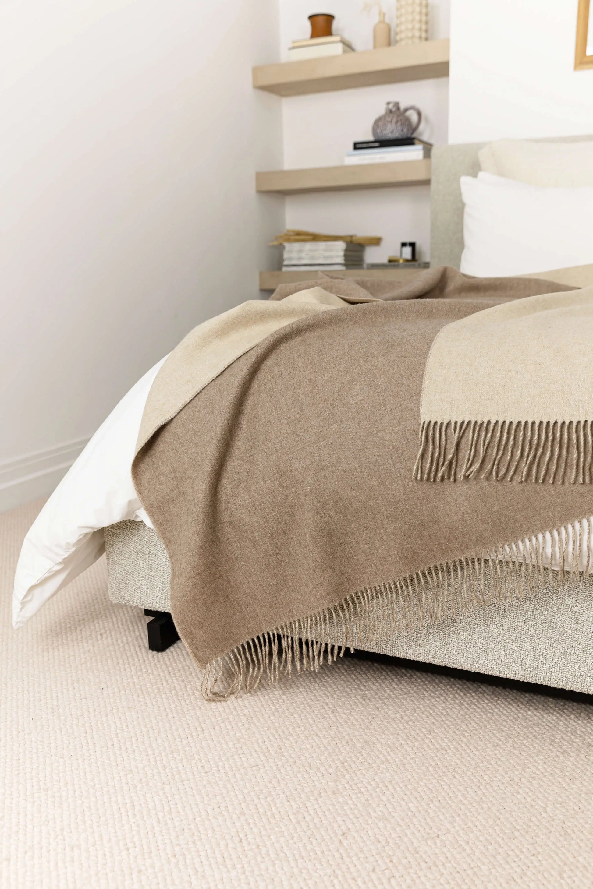 Johnstons of Elgin Blanket Collection Light Brown & Light Grey Reversible Cashmere Bed Throw draped over a bed on a white duvet cover WA001374RU6323ONE