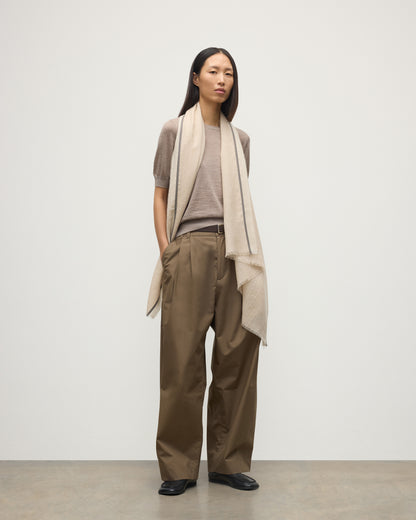 MODEL WEARS JOHNSTONS OF ELGIN IVES CHEVRON BORDER SCARF 100% CASHMERE OVER HONOR LIGHT BROWN T-SHIRT WA002446RU7701ONE