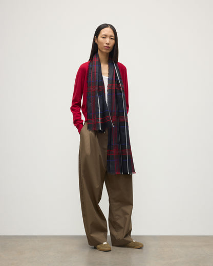 MODEL WEARS JOHNSTONS OF ELGIN ORTON CRAMMED TARTAN SCARF NAVY 100% CASHMERE WOEN OVER CRATHIE RED CASHMERE SHAWL COLLAR CARDI WA002447RU7703ONE