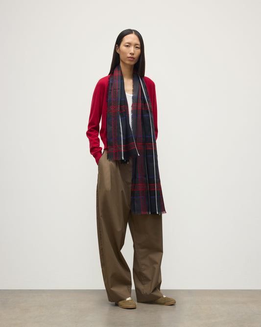 MODEL WEARS JOHNSTONS OF ELGIN ORTON CRAMMED TARTAN SCARF NAVY 100% CASHMERE WOEN OVER CRATHIE RED CASHMERE SHAWL COLLAR CARDI WA002447RU7703ONE