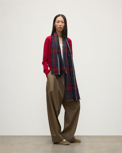 MODEL WEARS JOHNSTONS OF ELGIN ORTON CRAMMED TARTAN SCARF NAVY 100% CASHMERE WOEN OVER CRATHIE RED CASHMERE SHAWL COLLAR CARDI WA002447RU7703ONE