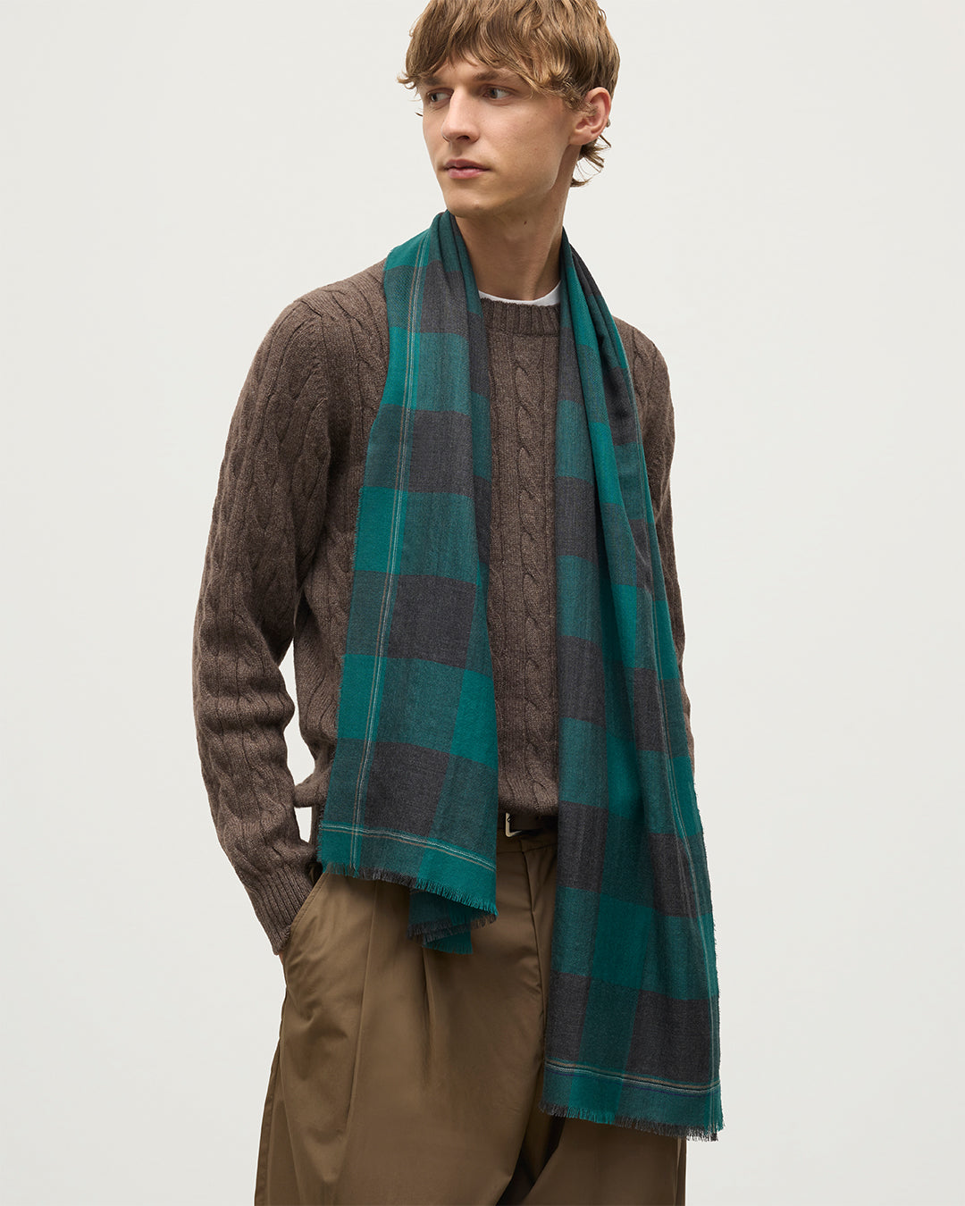 MALE MODEL WEARING JOHNSTONS OF ELGIN CARNBEE LARGE GINGHAM SCARF GREEN 100% CASHMERE OVER CALDER CASHMERE CABLE SWEATER IN VOLE BROWN WA002476RU7709ONE