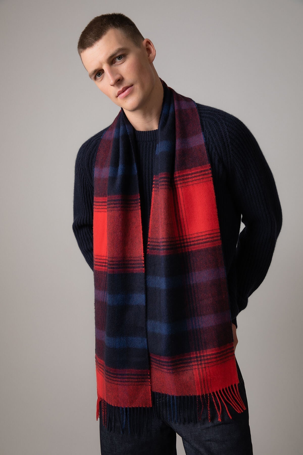 Johnstons of Elgin Asymmetric Check Cashmere Scarf in Red on a grey background WA000016RU7319ONE
