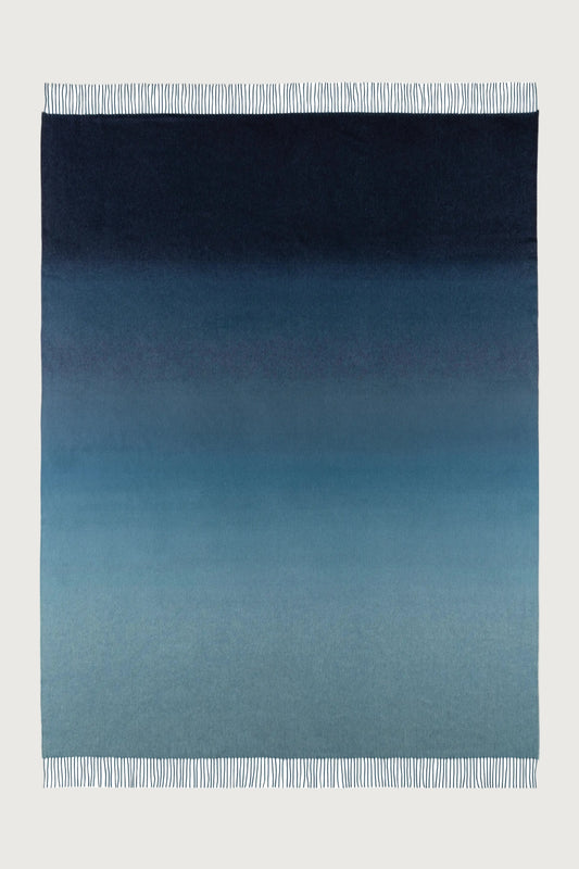 2025 Johnstons of Elgin Interiors Collection Seascape & Navy Ombré Cashmere Throw on a white background  WA000055RU7686ONE