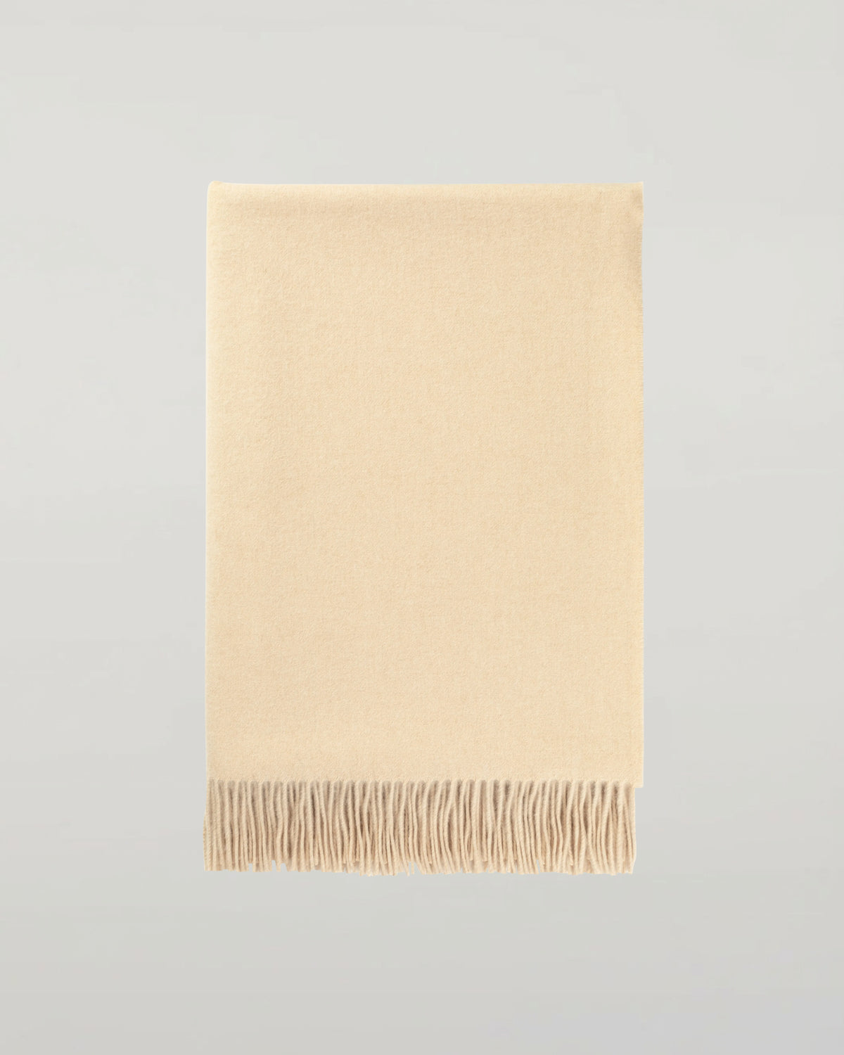 Johnstons of Elgin Interiors Collection Blonde Blonde Cashmere Throw on a grey background  WA000055HB0167ONE