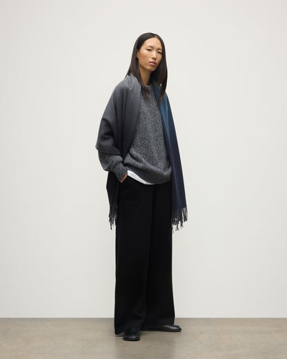 FEMALE MODEL WEARING JOHNSTONS OF ELGIN UMBRA OMBRE STOLE BLACK & NAVY 100% CASHMERE OVER BLACK & FYFE NAVY MARL CASHMERE KNITWEAR WA000056RU7302ONE