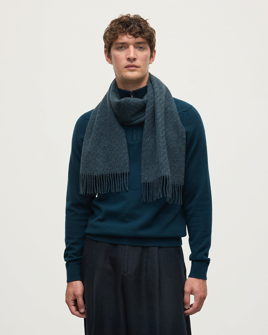 Model wears Johnstons of Elgin AW25 Woven Accessories Storm Lofty Twill Blue Cashmere Scarf WAC02307RU7657ONE