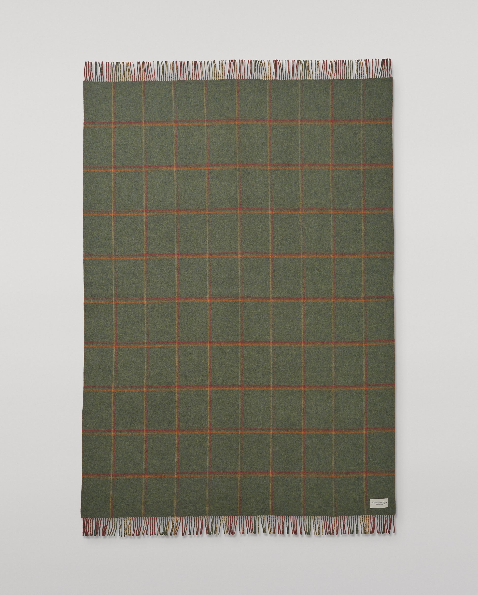 Johnstons of Elgin Interiors Collection Red Tweed & Green Windowpane Reversible Lambswool Throw on a grey background  WD000021XU0036N/A