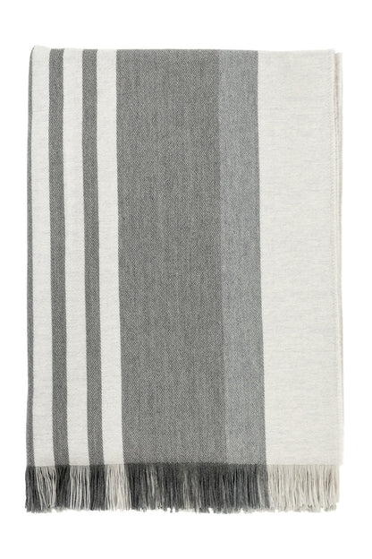 Johnstons of Elgin’s Bold Stripe Grey Merino Throw on brown chair on a white background WD000257RU6994ONE