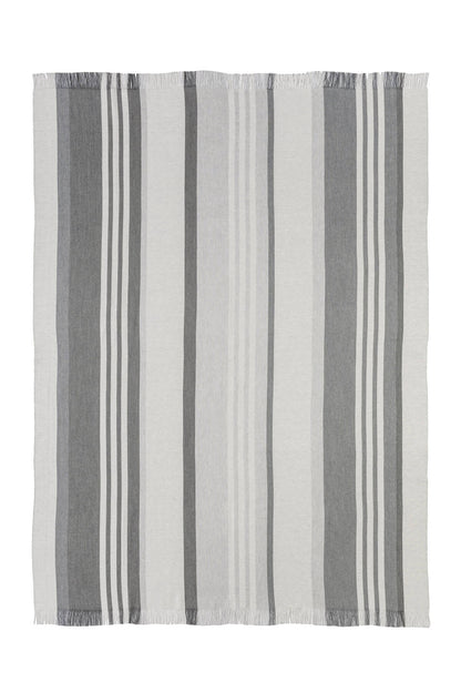 Johnstons of Elgin’s Bold Stripe Grey Merino Throw on brown chair on a white background WD000257RU6994ONE