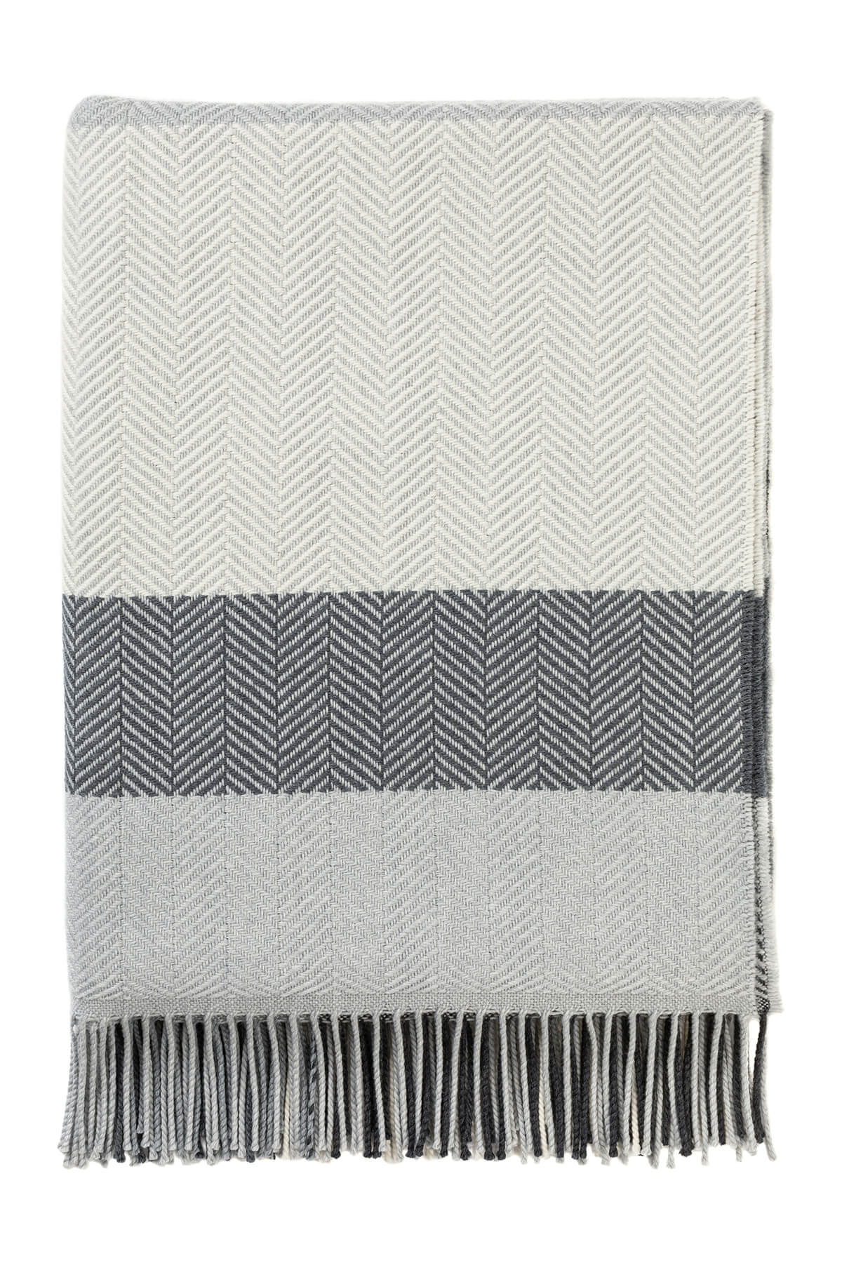 Johnstons of Elgin’s Grey & White Lofty Check Merino Throw on brown chair on a grey background WD001221RU6980ONE