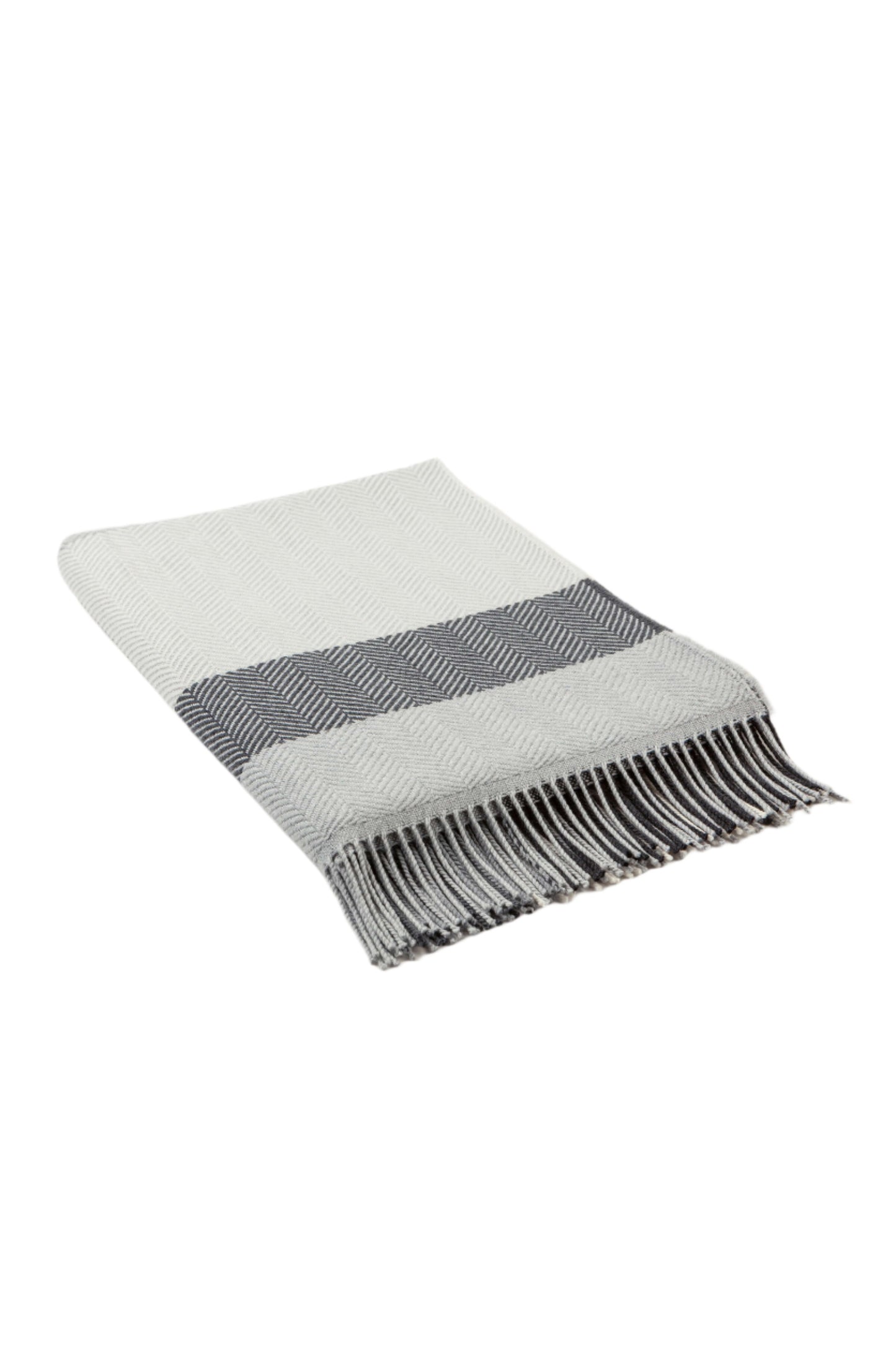 Johnstons of Elgin’s Grey & White Lofty Check Merino Throw on brown chair on a grey background WD001221RU6980ONE