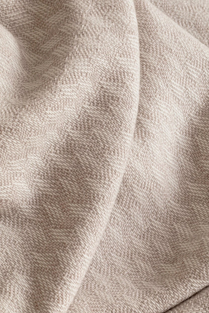 Johnstons of Elgin’s Lattice Weave Merino Bed Throw in Light Taupe & White on bed in neutral bedroom WD001243RU7268ONE