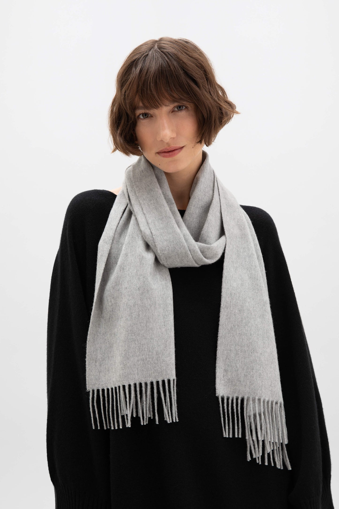 Johnstons of Elgin Ultrafine Merino Wool Scarf in Grey on a white background WDC01797HA0200ONE