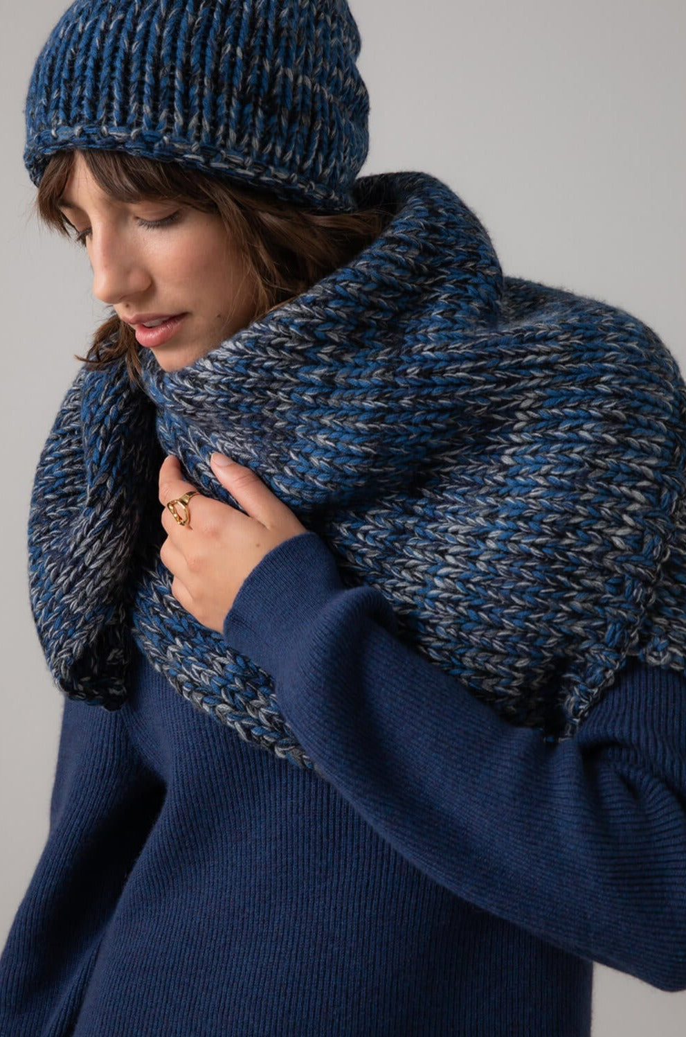 Model wearing Johnstons of Elgin Luxe Marl Cashmere Square Scarf in Navy Marl HAB03317Q23794
