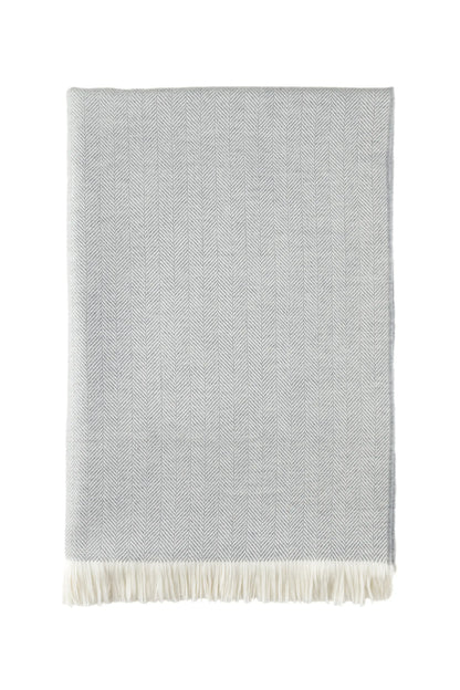 2025 Johnstons of Elgin Interiors Collection Mist & White Herringbone Merino Bed Throw on a white background  WD001115RU5857ONE